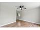 Serene bedroom with hardwood floors, fresh paint, and modern ceiling fan offers a cozy retreat at 321 E Taylor St, Landis, NC 28088