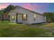 Beautiful single-story home with wood accents and a lush green lawn in a tranquil neighborhood at 321 E Taylor St, Landis, NC 28088