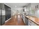 Modern kitchen with wood countertops, stainless steel appliances, and open layout for easy entertaining at 321 E Taylor St, Landis, NC 28088