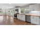 Modern kitchen features white cabinets, wood countertops, stainless steel appliances, and eat-in area at 321 E Taylor St, Landis, NC 28088
