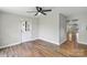 Bright, airy living room features modern ceiling fan, hardwood floors, and neutral paint, creating a cozy atmosphere at 321 E Taylor St, Landis, NC 28088