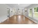 Spacious living room with new hardwood floors, neutral paint, and plenty of natural light from large windows at 321 E Taylor St, Landis, NC 28088