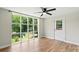 Inviting living room with large picture window and hardwood floors offers serene views of the backyard and natural light at 321 E Taylor St, Landis, NC 28088