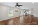 Bright open-concept living space featuring hardwood floors, fresh paint, and seamless flow into the kitchen at 321 E Taylor St, Landis, NC 28088