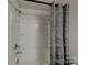 Bathroom featuring shower and tub combination with modern shower curtain at 3629 Cerelia Ln, Denver, NC 28037