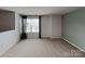 Upstairs carpeted bonus room featuring modern paint colors and a large window at 3629 Cerelia Ln, Denver, NC 28037