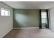 Spacious bedroom with carpet flooring, large window, and decorative curtains at 3629 Cerelia Ln, Denver, NC 28037
