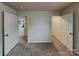 Bedroom with carpet flooring and doors to the hallway and a closet at 3629 Cerelia Ln, Denver, NC 28037
