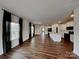 Open-concept living area featuring hardwood floors connecting to the kitchen with an island at 3629 Cerelia Ln, Denver, NC 28037