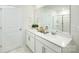 Well-lit bathroom features double sinks, white cabinets, chrome fixtures, and a large mirror at 3735 Coleman Dr, Charlotte, NC 28215