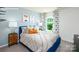 Cozy bedroom featuring a plush bed, stylish side tables, and bright natural light at 3735 Coleman Dr, Charlotte, NC 28215