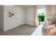 A bedroom bathed in natural light from the window, creating a tranquil atmosphere, paired with plush carpet at 3735 Coleman Dr, Charlotte, NC 28215