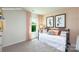 Inviting bedroom with a comfortable daybed, soft peach walls, and natural light from the window at 3735 Coleman Dr, Charlotte, NC 28215