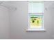 Bright walk-in closet featuring a window with scenic views, and white wire shelving units for optimal storage at 3735 Coleman Dr, Charlotte, NC 28215