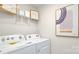 A neatly organized laundry room with modern appliances at 3735 Coleman Dr, Charlotte, NC 28215