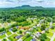 Breathtaking aerial view capturing the lush landscape and residences in a serene neighborhood setting at 3903 Graywood Dr, Gastonia, NC 28052