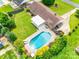 Aerial view of the backyard featuring a swimming pool, patio area and well-maintained landscaping at 3903 Graywood Dr, Gastonia, NC 28052