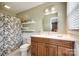 Bathroom with cherry vanity and a shower tub combo with curtain at 3903 Graywood Dr, Gastonia, NC 28052