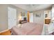 Bedroom with neutral walls, wood floors, two closets and ensuite bathroom entrance at 3903 Graywood Dr, Gastonia, NC 28052