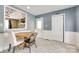 Cozy dining area features natural light, wood floors, and a view reflected in a decorative mirror at 3903 Graywood Dr, Gastonia, NC 28052