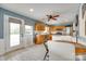 Eat-in kitchen with wooden cabinetry and tile floors, offers an airy, welcoming space at 3903 Graywood Dr, Gastonia, NC 28052