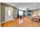 Inviting living room with hardwood floors, a brick fireplace, and ample natural light at 3903 Graywood Dr, Gastonia, NC 28052