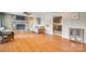 Bright living room with hardwood floors, brick fireplace and view to kitchen at 3903 Graywood Dr, Gastonia, NC 28052