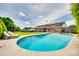 Beautiful pool with lounge chairs, a well-kept yard, covered patio, and house view in the background at 3903 Graywood Dr, Gastonia, NC 28052