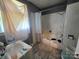 Bathroom area showcasing a window and a tub with a shower at 424 Congress S St, York, SC 29745