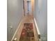 Hallway featuring carpet and entry to a bathroom at 424 Congress S St, York, SC 29745
