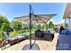 Outdoor patio with umbrella, grill, seating, and landscaping at 5064 Lassen Volcanic Trl, Lancaster, SC 29720