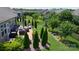 Aerial view of a beautifully landscaped backyard with a patio, outdoor furniture, and a well-maintained lawn at 5064 Lassen Volcanic Trl, Lancaster, SC 29720