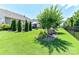 Picturesque backyard with lush lawn, landscaping, and fence creating a serene outdoor space at 5064 Lassen Volcanic Trl, Lancaster, SC 29720
