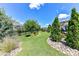 Beautiful backyard with well-maintained lawn, decorative rocks, and plenty of space to roam at 5064 Lassen Volcanic Trl, Lancaster, SC 29720