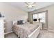 Serene bedroom features a comfortable bed, neutral tones, and ample natural light through shuttered windows at 5064 Lassen Volcanic Trl, Lancaster, SC 29720