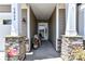 Inviting entryway featuring stone pillars, a covered porch, and a view of the front door at 5064 Lassen Volcanic Trl, Lancaster, SC 29720