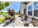 Charming front porch with stone accents and seating overlooking landscaped yard at 5064 Lassen Volcanic Trl, Lancaster, SC 29720