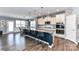 Stunning kitchen boasts a large island with seating and pendant lights, enhancing the contemporary design at 5064 Lassen Volcanic Trl, Lancaster, SC 29720
