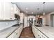 Modern kitchen with stainless steel appliances, granite countertops, and a central island for meal preparation at 5064 Lassen Volcanic Trl, Lancaster, SC 29720