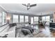Bright living room with plenty of windows, a modern sectional sofa, and an open layout, offers both relaxation and entertainment at 5064 Lassen Volcanic Trl, Lancaster, SC 29720