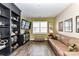 Comfortable living room featuring hardwood floors, a leather sofa, and built-in shelving at 5064 Lassen Volcanic Trl, Lancaster, SC 29720