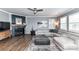 Inviting living room showcases a fireplace, plush gray sectional, and an open layout ideal for relaxation and entertaining guests at 5064 Lassen Volcanic Trl, Lancaster, SC 29720