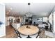 Open-concept living space with kitchen island, cozy dining nook, and inviting living room, perfect for entertaining and everyday living at 5064 Lassen Volcanic Trl, Lancaster, SC 29720