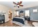 Serene main bedroom boasts a stylish headboard, designer nightstands, and an ensuite bathroom offering comfort and style at 5064 Lassen Volcanic Trl, Lancaster, SC 29720