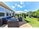 Enjoy this beautiful brick patio and comfortable wicker seating overlooking a manicured lawn at 5064 Lassen Volcanic Trl, Lancaster, SC 29720