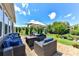 Inviting patio with outdoor seating, umbrella, and well-manicured landscaping is perfect for entertaining at 5064 Lassen Volcanic Trl, Lancaster, SC 29720