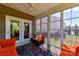 Inviting sunroom with comfortable seating and plenty of natural light at 5064 Lassen Volcanic Trl, Lancaster, SC 29720