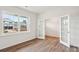 Bright flex room with glass French doors and wood-look floors at 5244 Reedy Ridge Rd, Charlotte, NC 28215