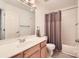 Well-lit bathroom with a shower-tub combination and a modern vanity at 5832 Lagrande Dr, Charlotte, NC 28269