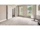 Bright bedroom with neutral carpet, and lots of natural light from the two large windows at 5832 Lagrande Dr, Charlotte, NC 28269